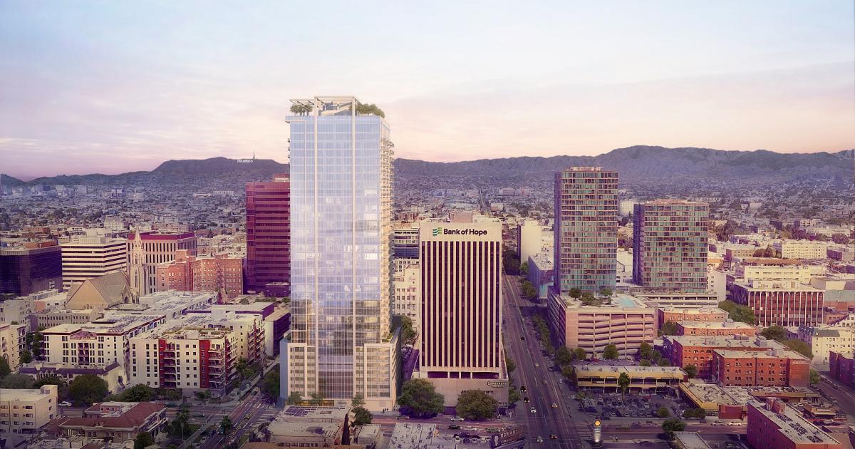 Glass exterior climbs Hallasan apartment tower at 696 S New Hampshire